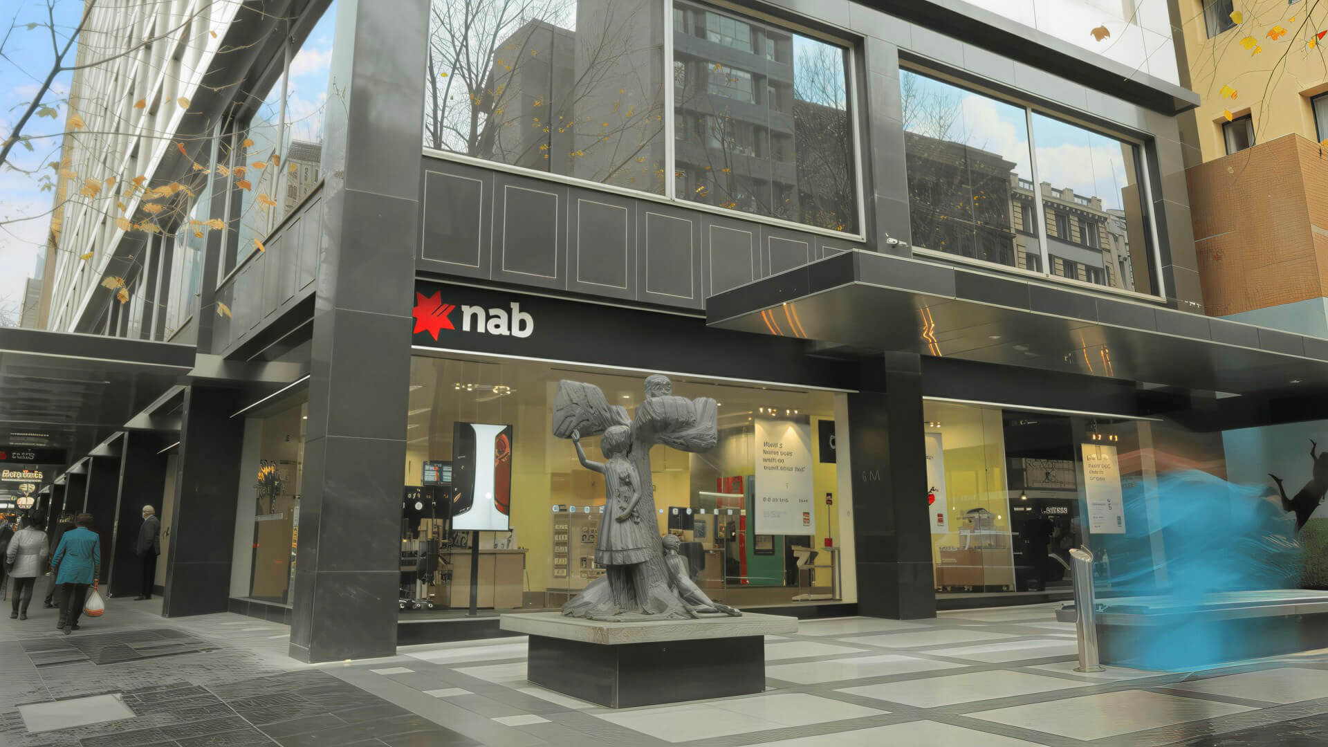 NAB bank branch exterior with sculpture in front.
