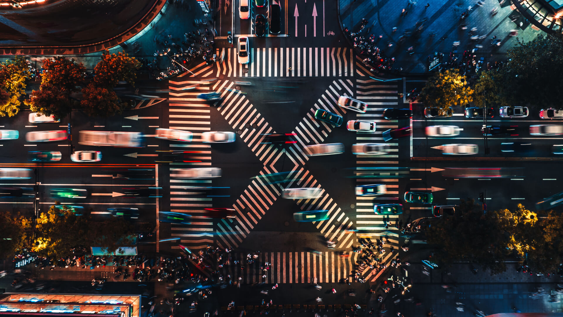 Aerial view of a busy city intersection at night.