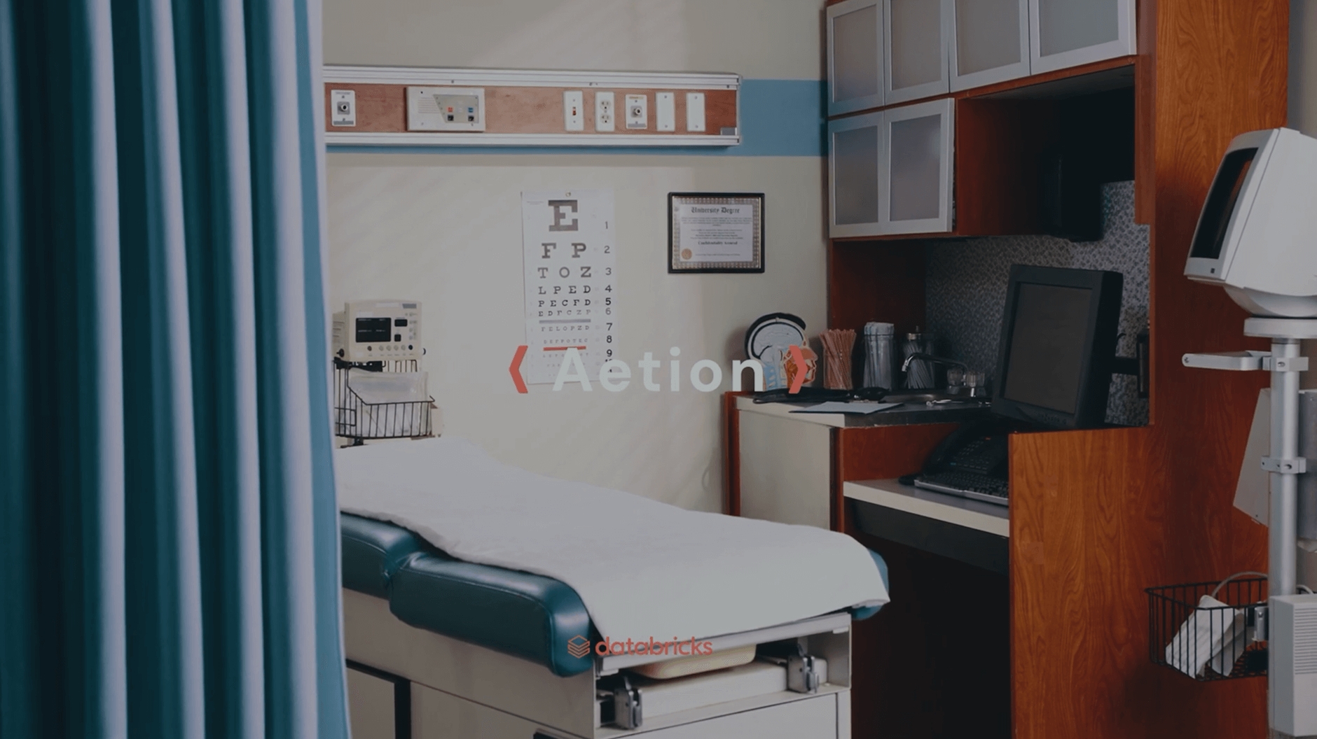 Medical exam room with exam table and eye chart.