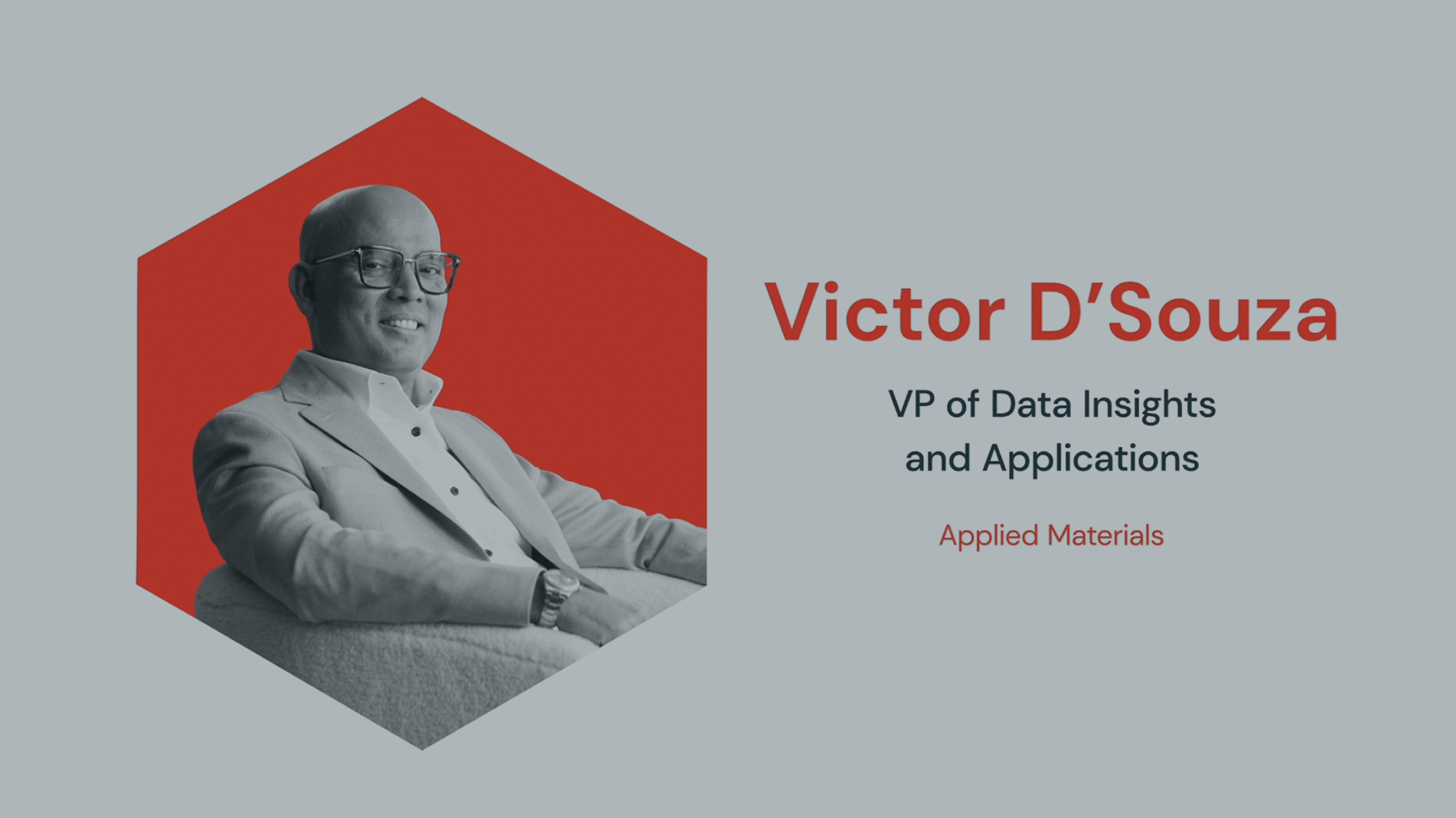 Man in suit seated beside text with job title and company.