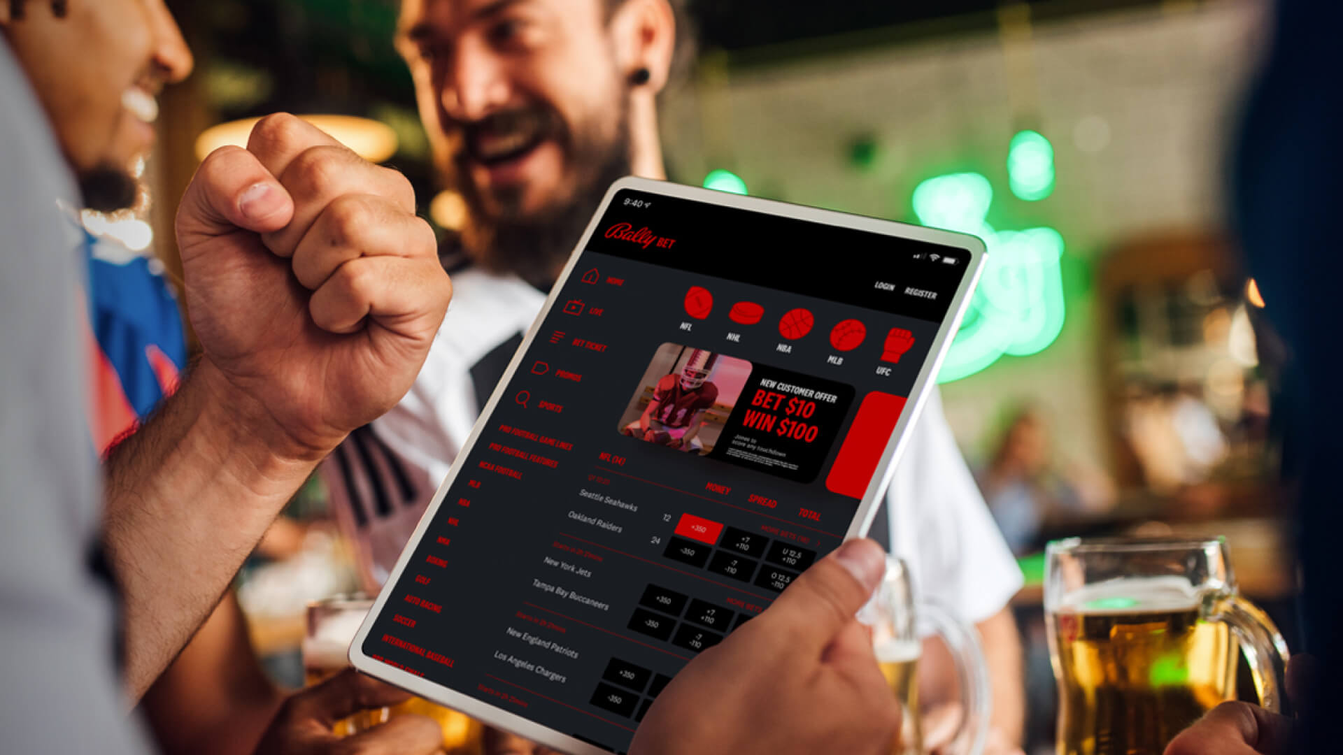 Man views Bally Bet app on tablet with friends.