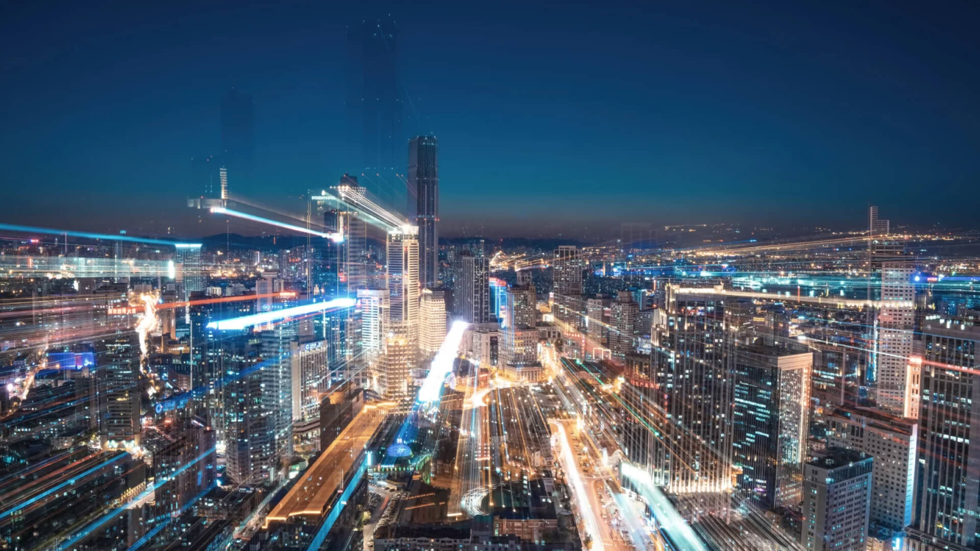 Futuristic city night view with light trails.