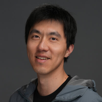 Portrait of a smiling Asian man.