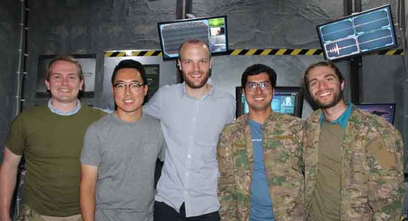 Miles Yucht(on the right) with the Databricks Amsterdam team at a post-apocalypse themed escape room