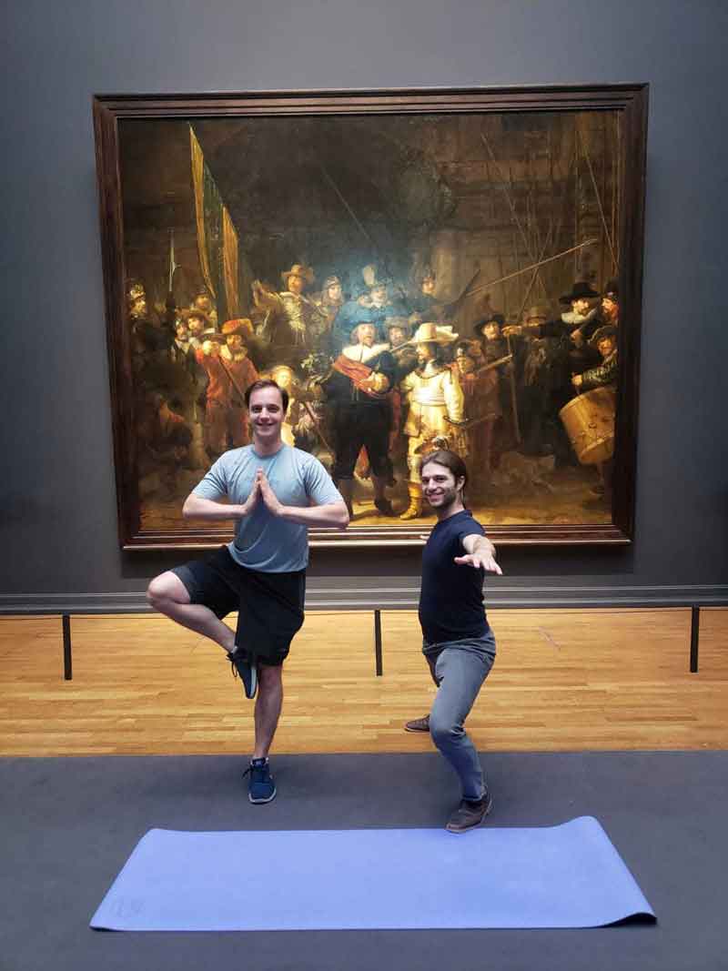 Working abroad with Databricks: Miles Yucht enjoys yoga at the Amsterdam Rijksmuseum with coworker