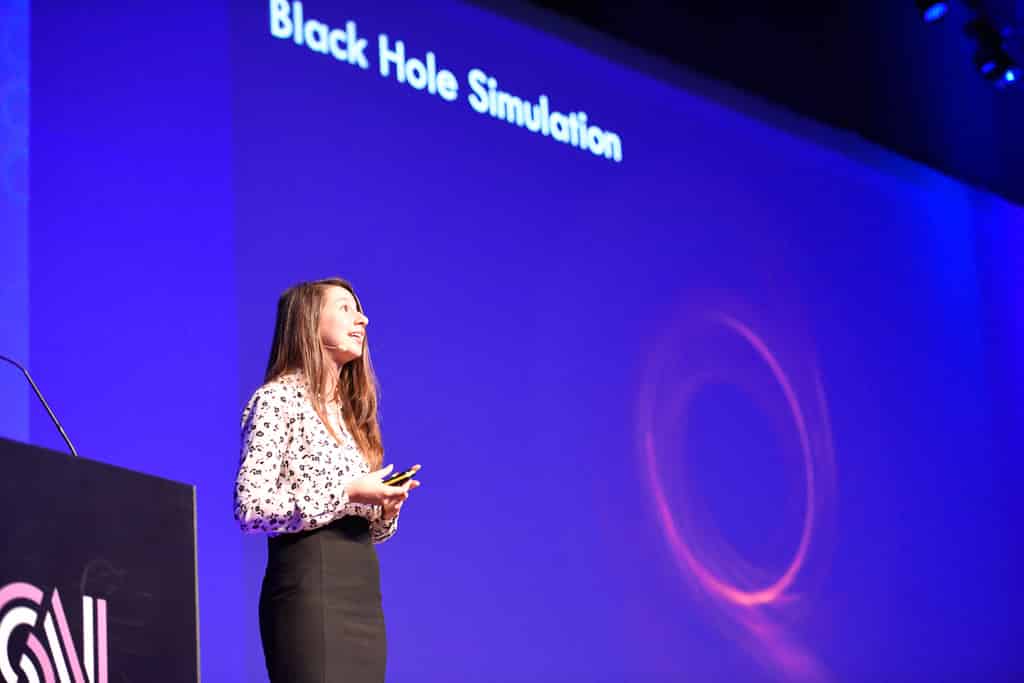 Katie Bouman presents to the crowd onstage at Databricks' Spark Summit 2019 in Amsterdam.