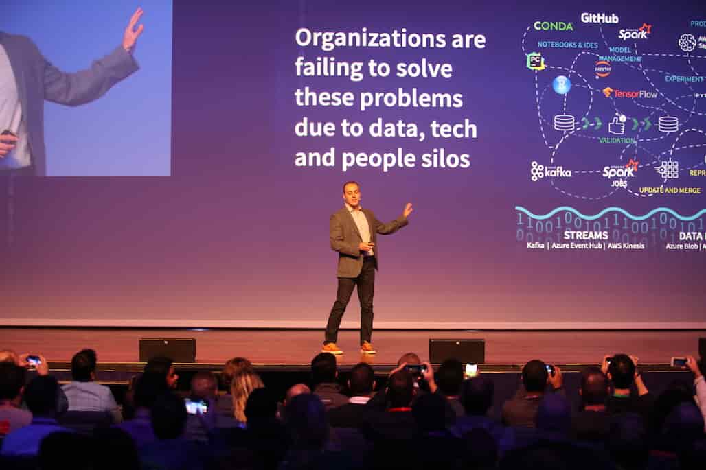 Ali Ghodsi addressing the audience at Spark + AI Summit Europe 2019 in Amsterdam.