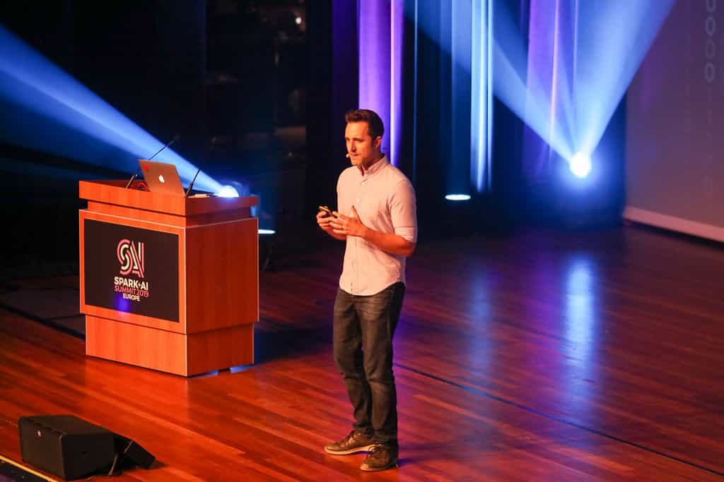 Databricks' Michael Armbrust speaking onstage at Spark + AI Summit Europe 2019 in Amsterdam.